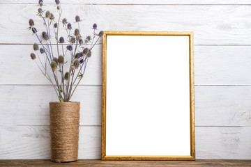 Golden picture frame with decor