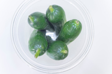 Little fresh cucumbers packaged for picnic in PET plastic cup