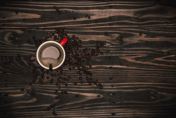 Coffee cup and coffee beans on table. Top view with copy space for your text. espresso hot.