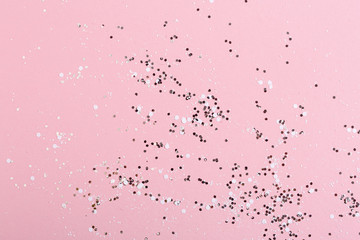 silver glitter on a pink background