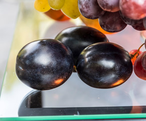 Black ripe plum closeup.