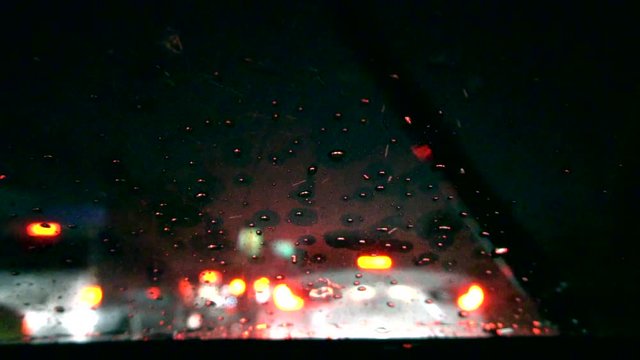Heavy raining night traffic view from inside a car