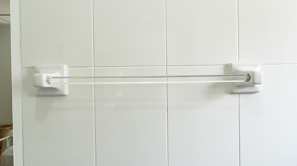 A towel hanger that is attached to the wall