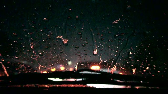 Heavy raining night traffic view from inside a car