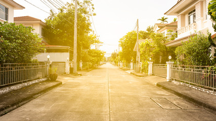 Village road With orange lights and houses around