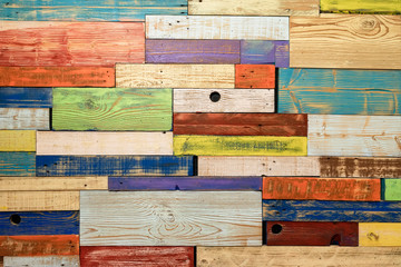 Multicolored wooden boards, painted planks of wall. texture. For modern colorful background on various topics