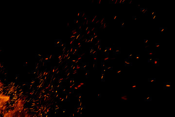 flame of fire with sparks on a black background