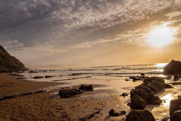 a sunset on Barrika beach in Biscay