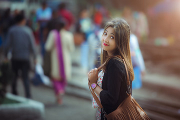 Indian girl dressing up for a walk in public