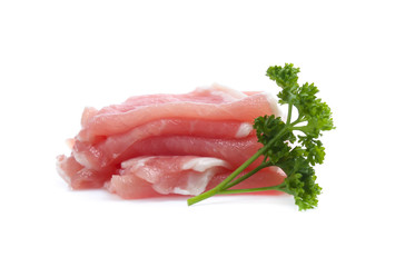 Raw pork meat with parsley herb leaves isolated on white background