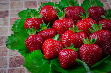 Juicy tasty red strawberries on a plate
