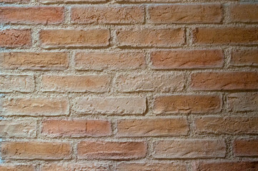 Rough brown brickwork with white seams