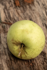 natural and healthy green apple on a wooden table with copy space