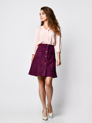 A successful young businesswoman, isolated on white background