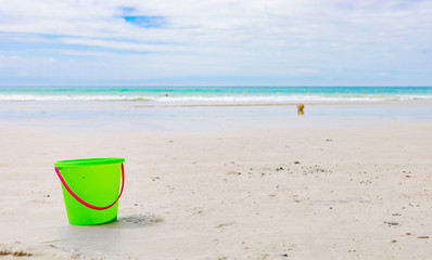 Plastic Kids Bucket for making sandcastles on a sandy beach