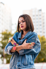 Portrait of young fashionable woman wearing jeans