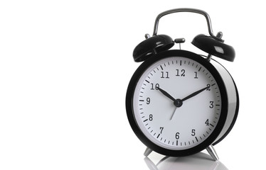 Black alarm clock isolated on white