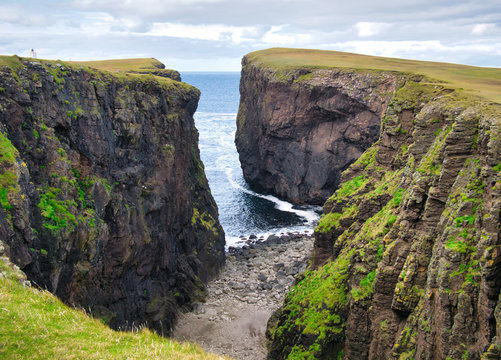 Calder's Geo on Eshaness, Shetland, UK - The rock is of the Eshaness Volcanic Formation - pyroclastic-breccia - igneous bedrock formed in the Devonian Period.