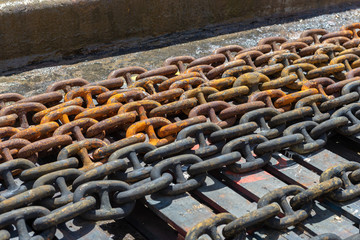 Rusty anchor chain in dry dock
