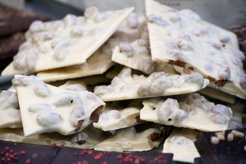 white chocolate bars with hazelnuts on the counter