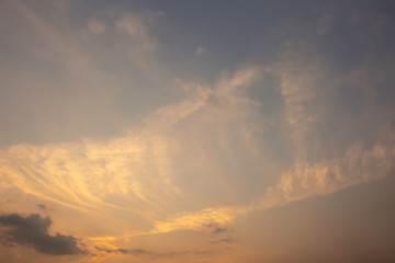 Orange sky covered with many clouds