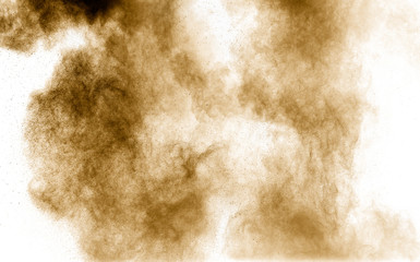 Brown dust explosion cloud.Brown particles splatter on white background.