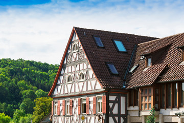 White half timbered house with orange shutters in Untermunkheim, Germany