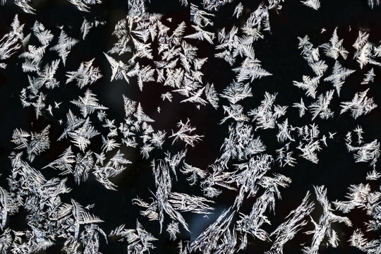 Beautiful natural frosty pattern on winter window. seamless