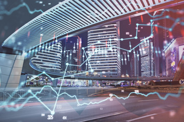 Forex chart on cityscape with tall buildings background multi exposure. Financial research concept.