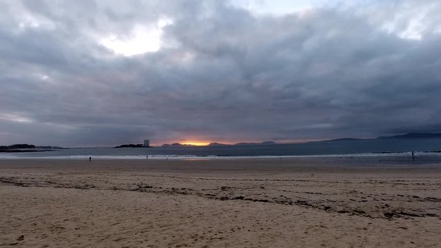 Timelapse of a sunset over Samil beach in Vigo, Spain