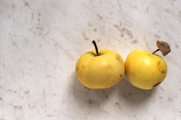 Yellow Golden Delicious apples rustic wooden table. Top view point.