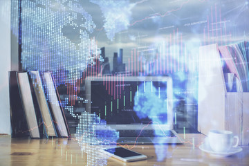 Financial chart drawing and table with computer on background. Multi exposure. Concept of international markets.