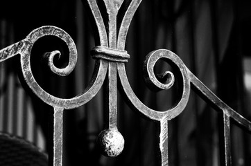 Exquisite forged elements of metal fencing in black and white