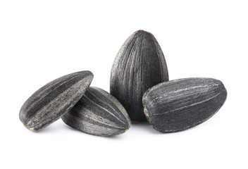 Close-up of delicious sunflower black seeds, isolated on white background