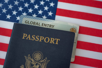 Global Entry card (Trusted traveller) covered of Passport of United states of America on American...