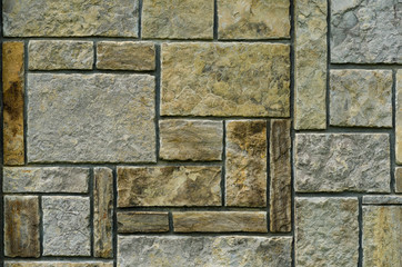 Fototapeta premium Background image of a beautiful stone fence, with chopped stones
