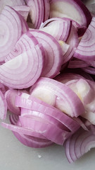 sliced shallot on white board, asian herb for cooking,with knife