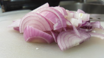 sliced shallot on white board, asian herb for cooking,with knife