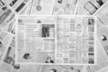 Obraz premium Abstract blurred background from old news papers, no focus