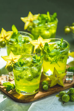 Green gooseberry and carambola cocktail or detox drink, sunny light