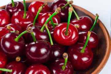 Plate with fresh delicious cherries