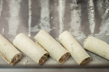 man making icecream rolls