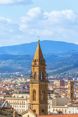 Tower in the city and the mountains in Florence, Italy