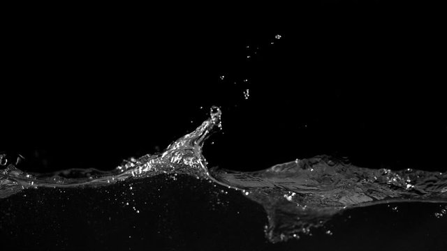 Super slow motion of splashing water isolated on black background. Filmed on very high speed camera, 1000 fps.