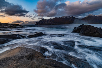 Fototapeta na wymiar Waves Crashing On Rocks In Senja Norway