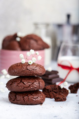 Chocolate brownie cookies served with glass of milk