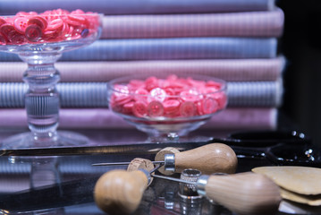 Assorted Tailor's Tools on Glass Table