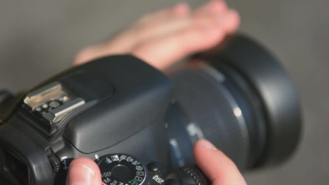 Photographer Takes Pictures with Digital Camera