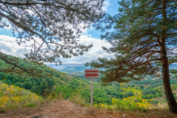 Caution cliff - a plate is installed in the mountains, in Kislovodsk national park