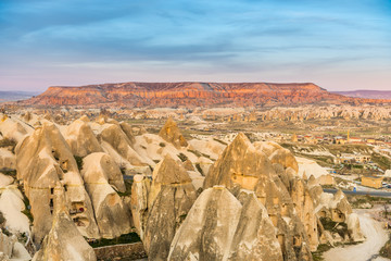  Red Valley and Rose Valley and downtown of Goreme under the twilight  in the evening Cappadocia, Turkey.
